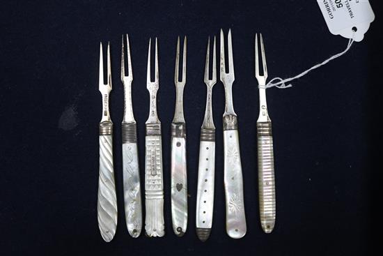Seven 19th century and later silver and mother of pearl handled travelling forks a similar silver fruit knife and three other items.